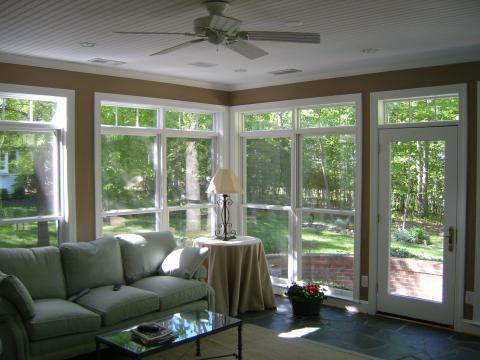 Traditional Sunroom with black metal base table lamp with white shade