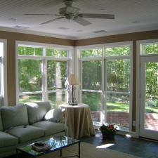 Traditional Sunroom with black metal base table lamp with white shade