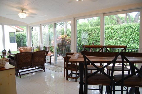 Transitional Sunroom with ceiling fan with light
