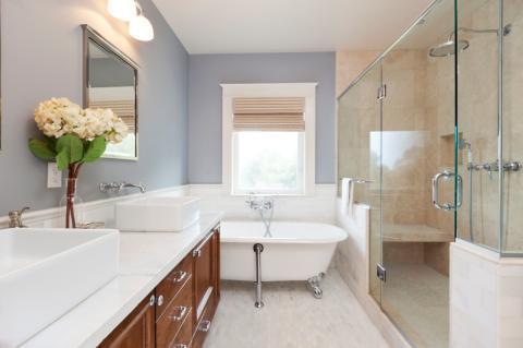 Transitional Bathroom with white porcelain stand alone tub