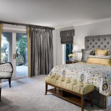 Transitional Bedroom with ceiling to floor drapes