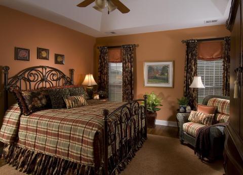 Traditional Bedroom with rust colored valance
