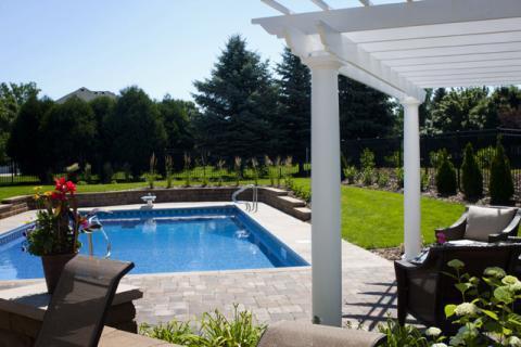 Traditional Pool with rock retaining wall