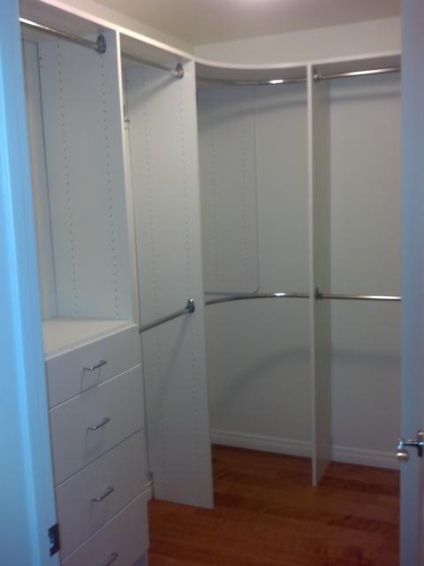 Traditional Closet with natural stained hardwood floor