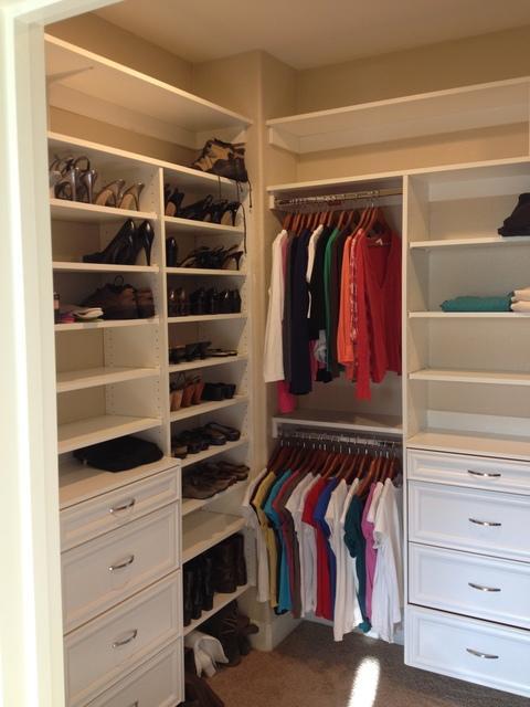 Traditional Closet with beige painted walls