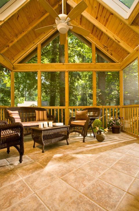 Traditional Sunroom with brown wicker furniture