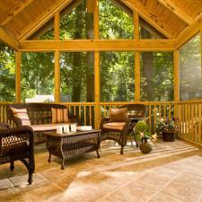 Traditional Sunroom with brown wicker furniture