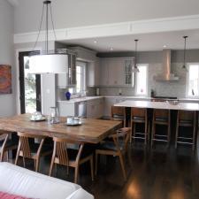 Eclectic Dining Room with white millwork at chrown moulding height