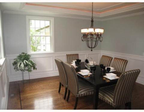 Traditional Dining Room with brown and white stripped dining chairs