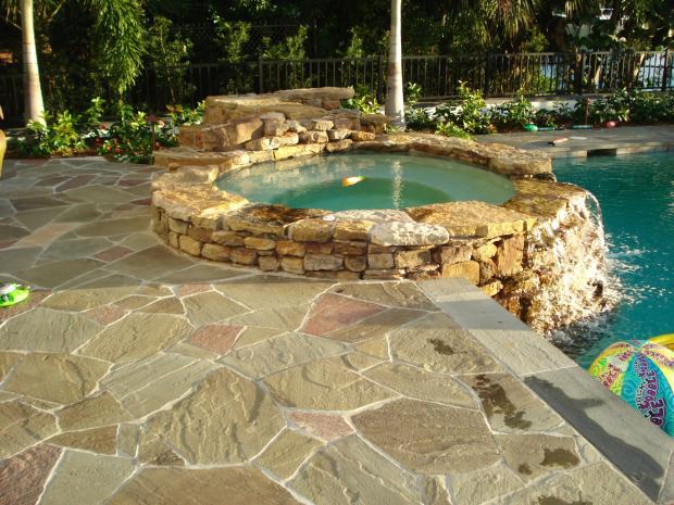 Rustic Patio with natural looking hot tub