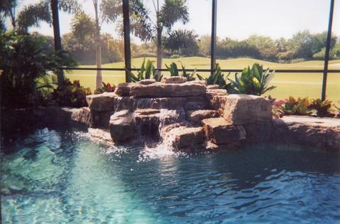 Traditional Sunroom with water fall into pool