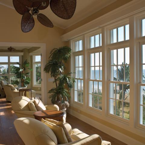 Transitional Sunroom with cream colored overstuffed recliner chairs