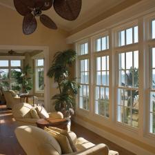 Transitional Sunroom with cream colored overstuffed recliner chairs