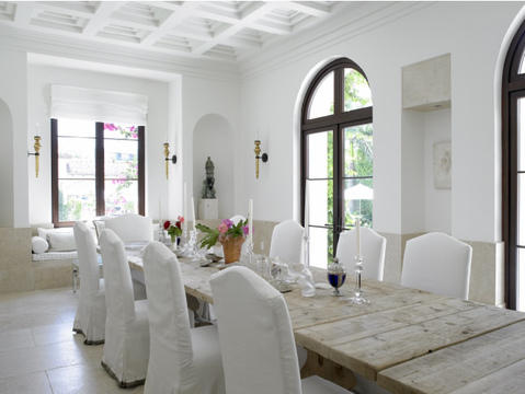 Eclectic Dining Room with rough cut wood plank banquet table