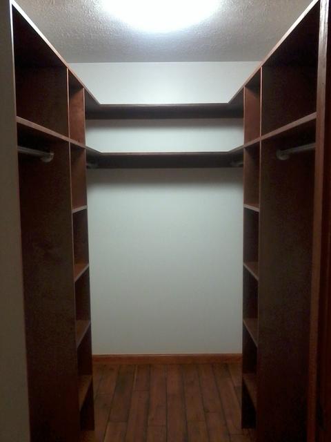 Traditional Closet with built in closet shelving