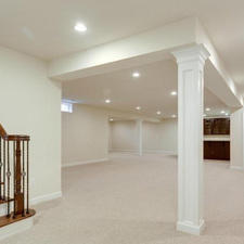 Traditional Basement with white walls and trim