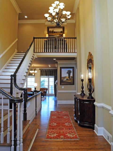 Traditional Entry with black metal hanging chandelier