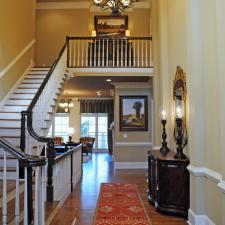 Traditional Entry with black metal hanging chandelier