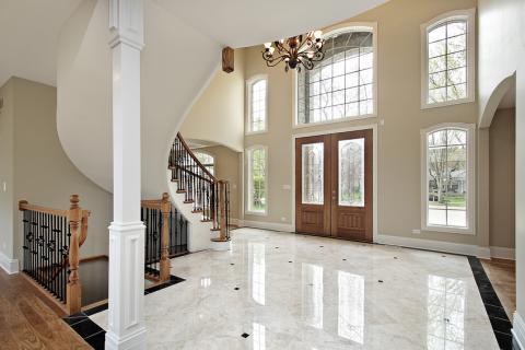 Traditional Entry with large black metal hanging chandelier