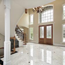 Traditional Entry with large black metal hanging chandelier