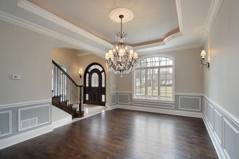 Traditional Living Room with small windows rounding front door