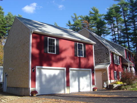 Traditional Garage with white panel garage doors
