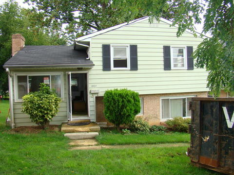 Traditional Home Exterior with large basement window