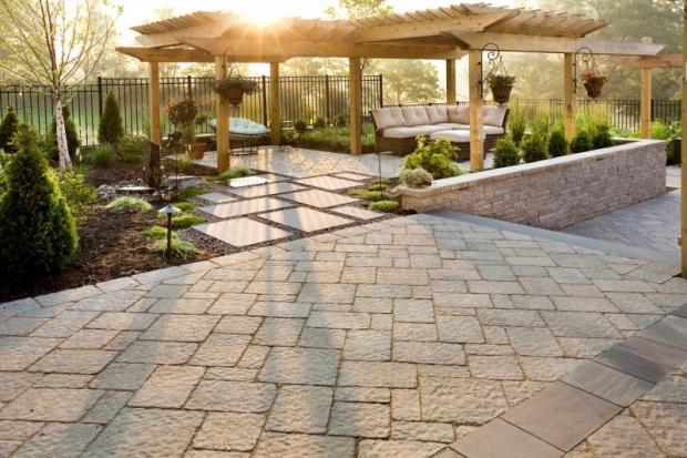 Traditional Landscape with wicker sectional outdoor couch