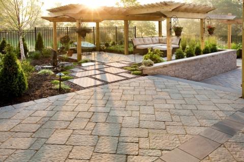 Traditional Landscape with wicker sectional outdoor couch