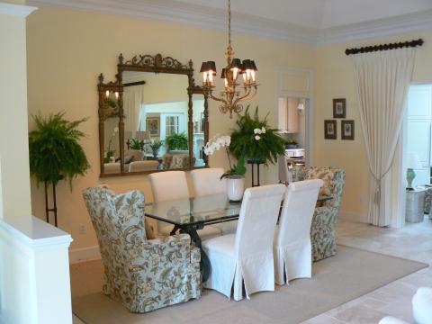 Traditional Dining Room with gold metal candle stick chandelier with black shades
