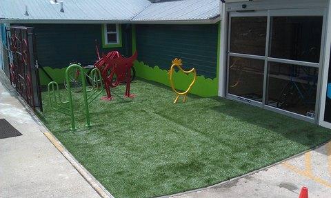 Modern Landscape with metal bike artwork entry wall