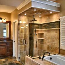 Traditional Bathroom with tan porcelain tile shower wall covering