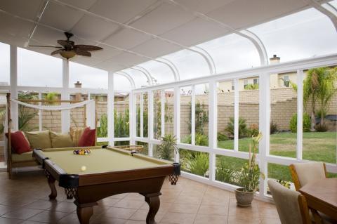 Traditional Sunroom with brown ceramic tile floor
