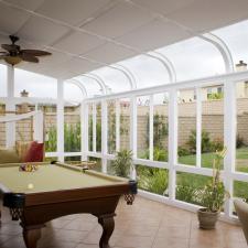 Traditional Sunroom with brown ceramic tile floor