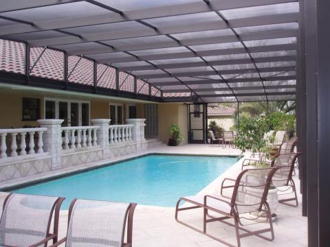 Traditional Pool with outdoor patio lounge furniture
