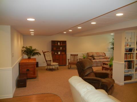 Traditional Basement with white acoustical tile ceiling