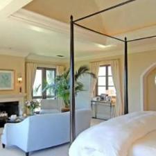 Traditional Bedroom with pale yellow custom window treatment
