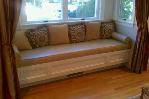 Traditional Family Room with white wood built-in window bench seating