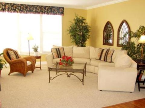 Eclectic Family Room with glass top coffee table