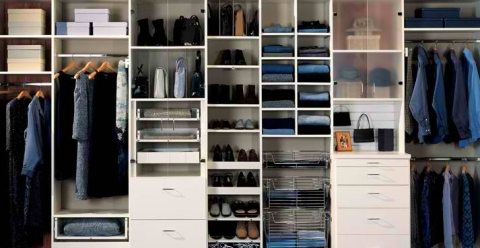 Traditional Closet with multiple hanging racks