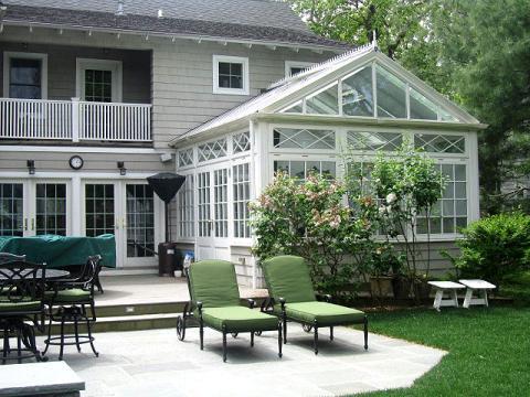 Traditional Patio with green upholstered seat cushions