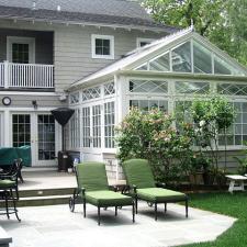 Traditional Patio with green upholstered seat cushions