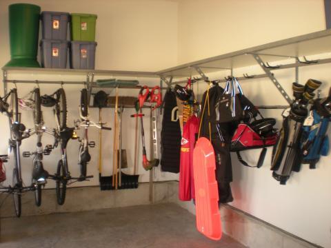 Contemporary Garage with stainless steel garage shelving