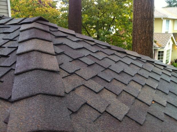 Traditional Home Exterior with black roof shingles