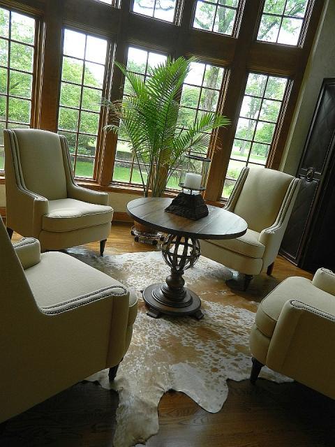 Traditional Living Room with dark wood and black leather folding partition wall