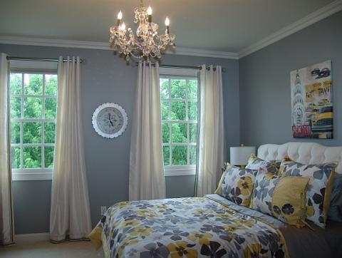 Transitional Bedroom with white cushioned headboard