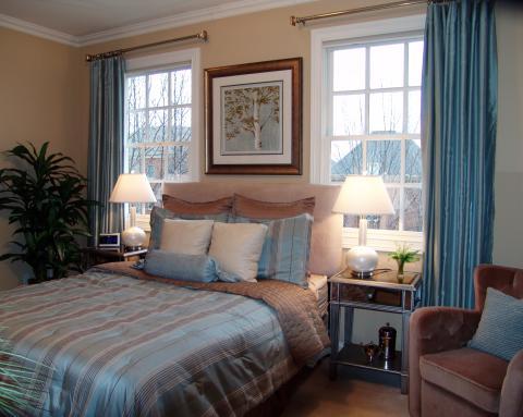 Traditional Bedroom with blue and brown striped bedding