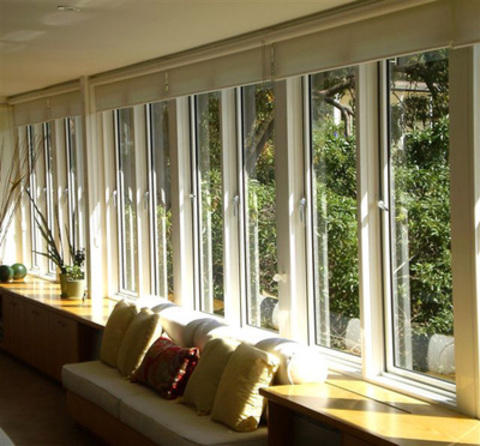 Contemporary Sunroom with window bench seat