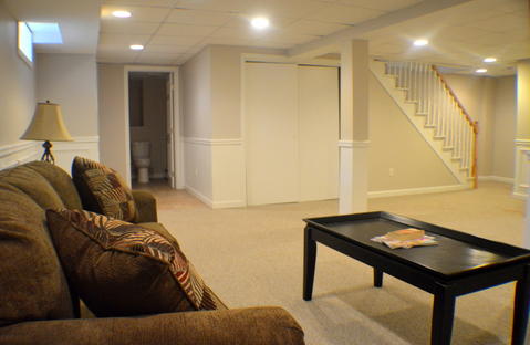 Traditional Basement with off white painted walls