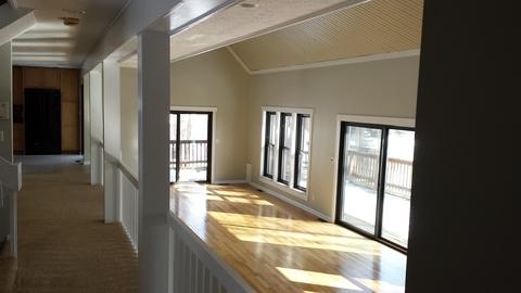 Transitional Sunroom with light hardwood floor
